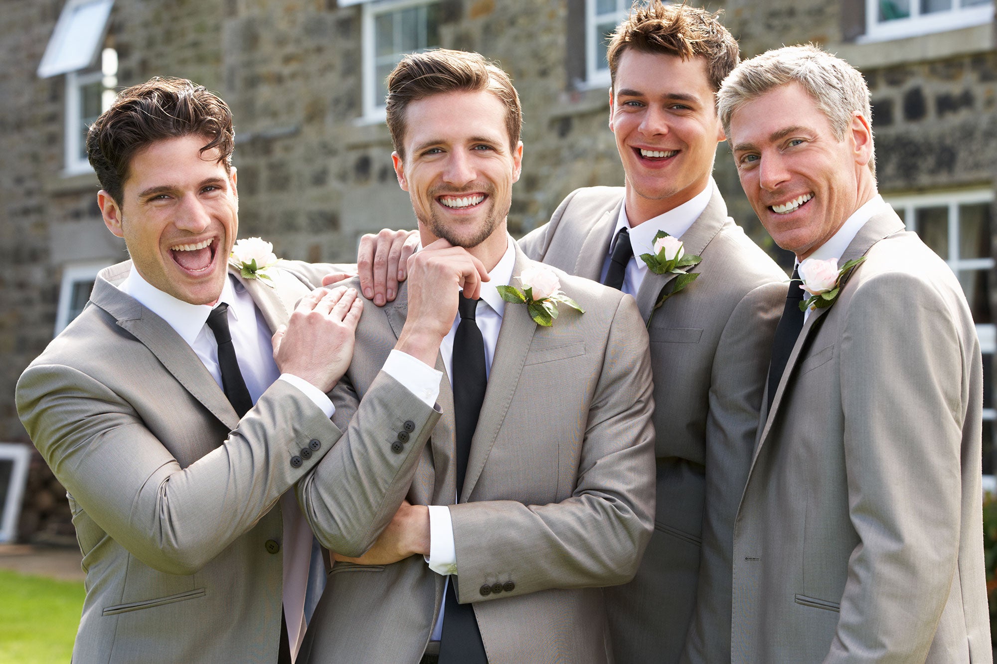 The groom and groomsmen in matching motif satin ties