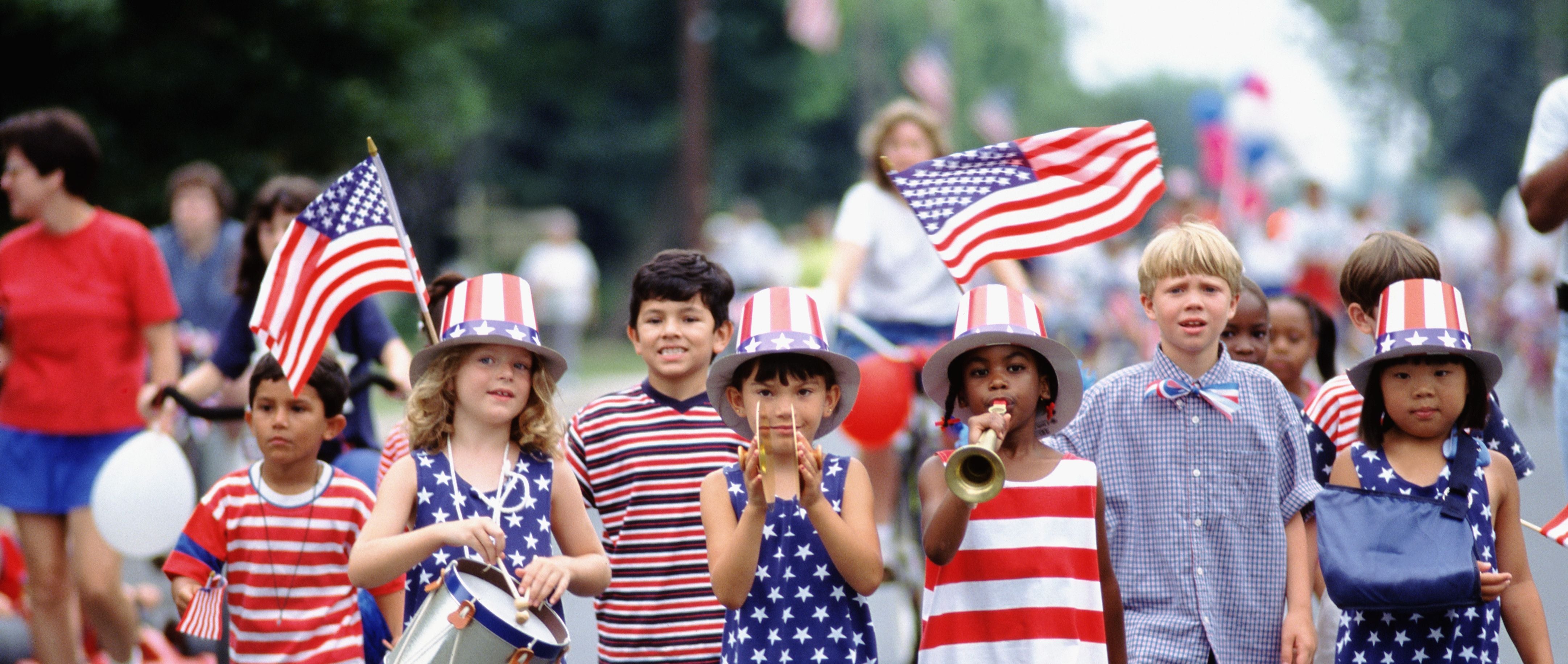 Children of different ethnicities march together on Independence Day