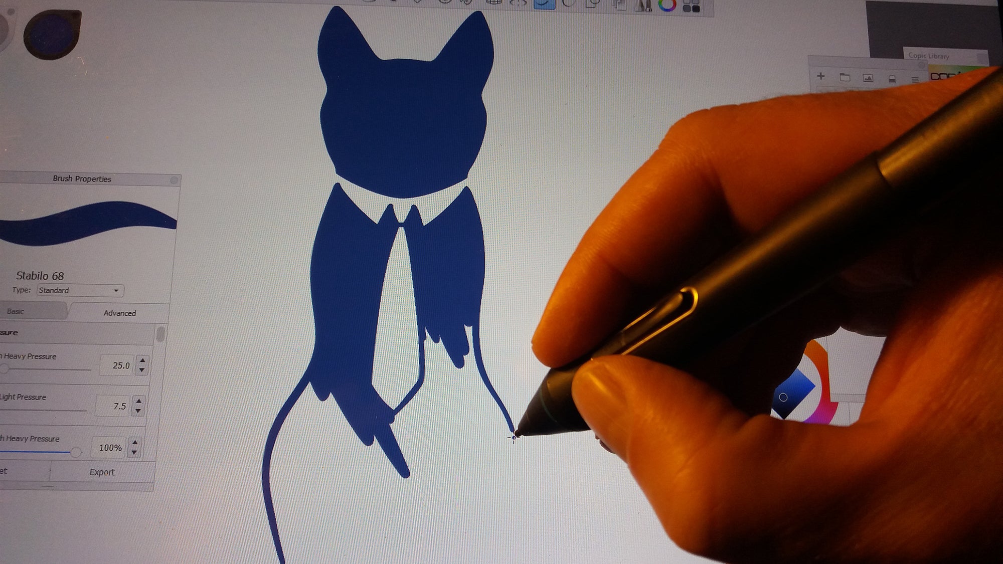 Artist Zoltan Nemes making the KissTies logo