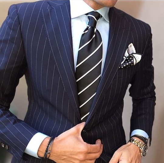 Man in suit and striped tie.